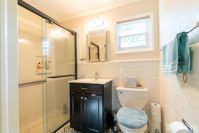 full bathroom featuring tile walls, crown molding, a stall shower, toilet, and vanity