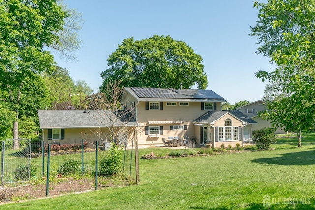 rear view of property featuring a patio area