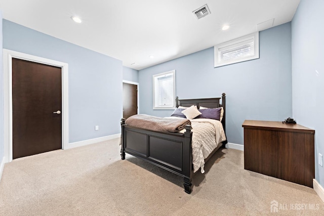 bedroom featuring light carpet, recessed lighting, visible vents, and baseboards