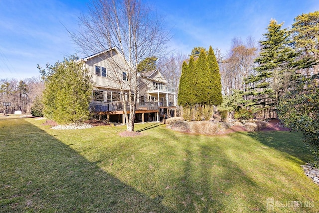 view of yard featuring a wooden deck