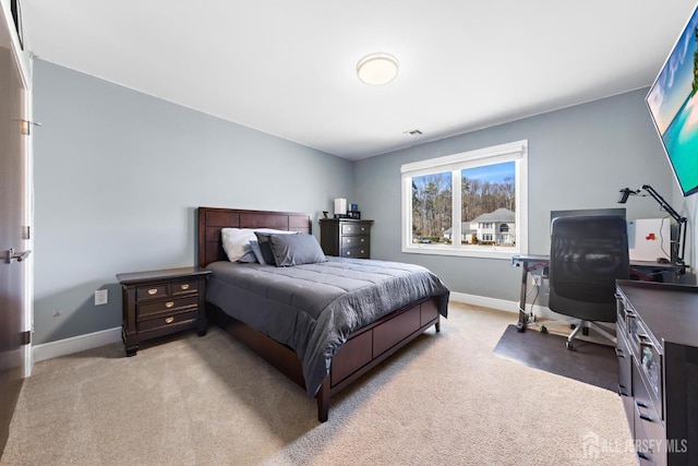 bedroom featuring carpet floors, visible vents, and baseboards