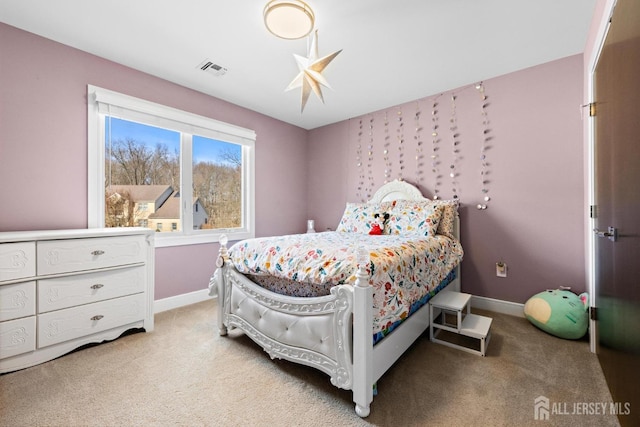 carpeted bedroom with visible vents and baseboards