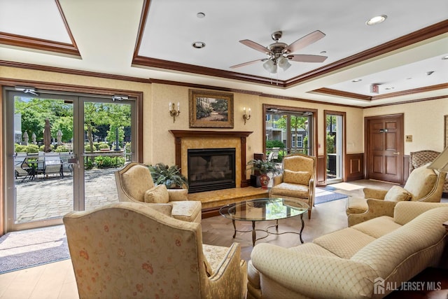 540 Cranbury Rd Unit 105, East Brunswick, NJ 08816 - living area with a raised ceiling, crown molding, a glass covered fireplace, ceiling fan, and wainscoting