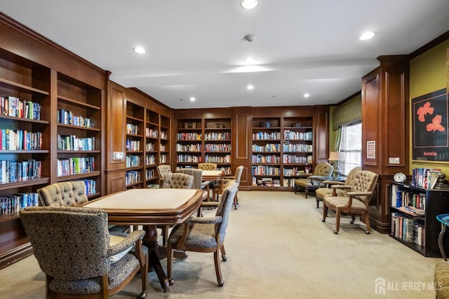 540 Cranbury Rd Unit 105, East Brunswick, NJ 08816 - sitting room with wall of books, light carpet, and recessed lighting