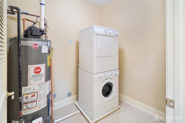 540 Cranbury Rd Unit 105, East Brunswick, NJ 08816 - laundry area with gas water heater, stacked washing machine and dryer, and baseboards