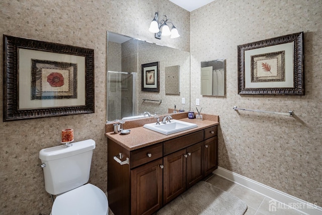 540 Cranbury Rd Unit 105, East Brunswick, NJ 08816 - bathroom featuring vanity, tile patterned floors, a tile shower, toilet, and baseboards