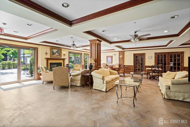 540 Cranbury Rd Unit 105, East Brunswick, NJ 08816 - living area with a ceiling fan, crown molding, coffered ceiling, healthy amount of natural light, and decorative columns