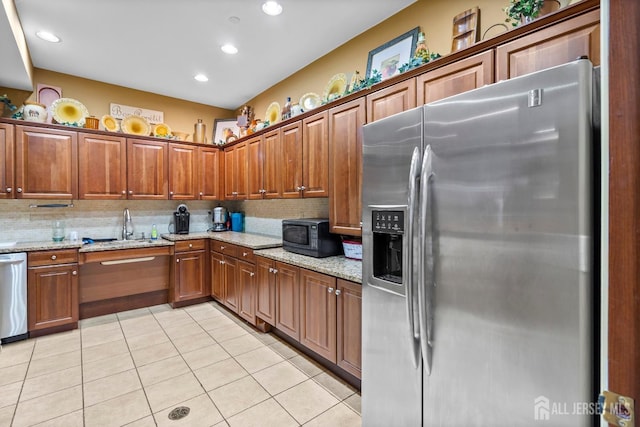 540 Cranbury Rd Unit 105, East Brunswick, NJ 08816 - kitchen with stainless steel appliances, a sink, backsplash, light stone countertops, and recessed lighting