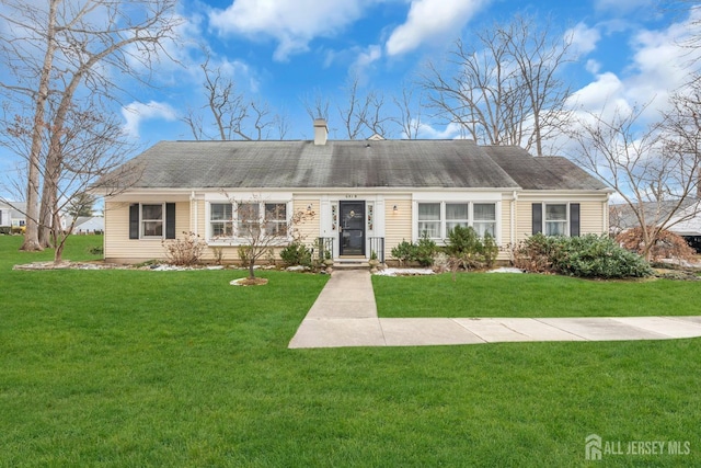 ranch-style house with a front lawn