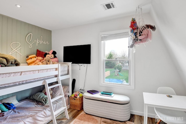 bedroom featuring recessed lighting, visible vents, baseboards, and wood finished floors