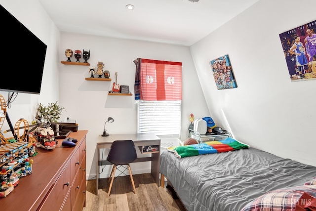 bedroom featuring light wood-style flooring