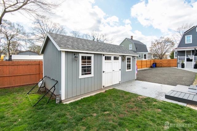 view of shed with a fenced backyard