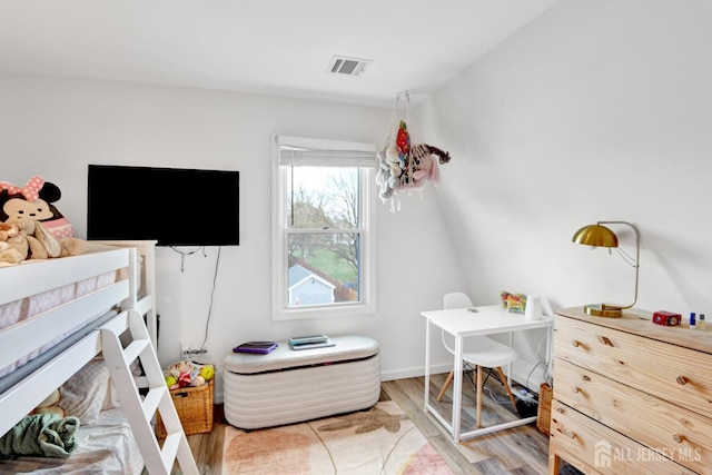 bedroom featuring visible vents and light wood-type flooring