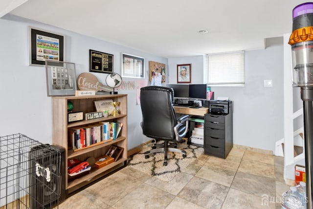 office space featuring baseboards