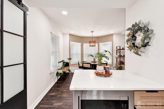 kitchen featuring recessed lighting, dark wood-style flooring, light countertops, wine cooler, and baseboards