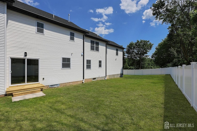 14 Thomasine St, Edison, NJ 08817 - rear view of house with entry steps and a fenced backyard
