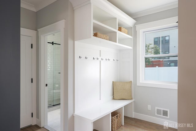 14 Thomasine St, Edison, NJ 08817 - mudroom featuring light wood finished floors and ornamental molding