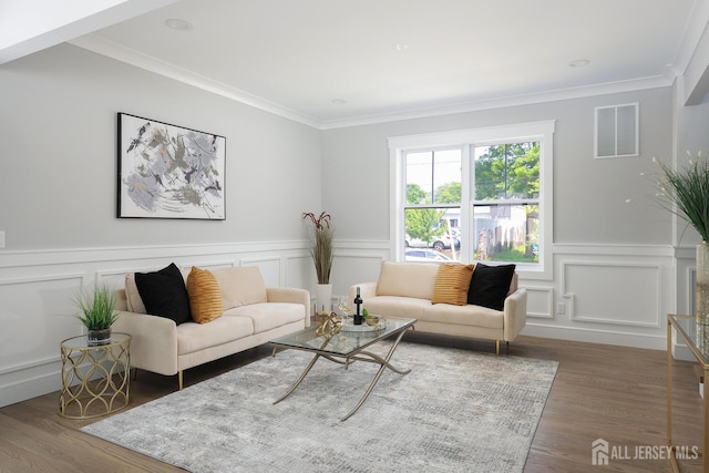 14 Thomasine St, Edison, NJ 08817 - living room featuring a decorative wall, ornamental molding, wood finished floors, and wainscoting