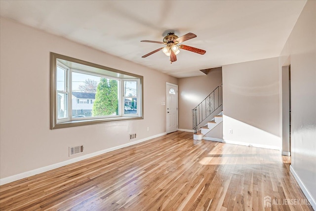 interior space with ceiling fan and light hardwood / wood-style flooring