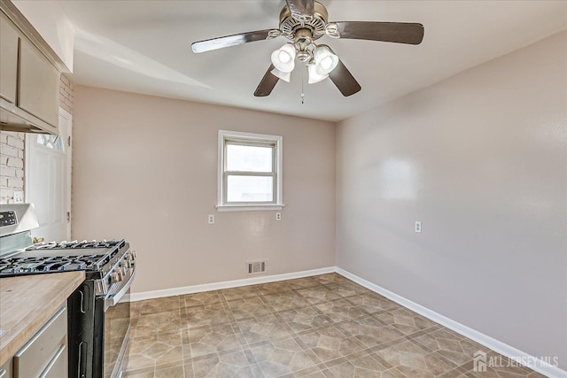 kitchen featuring ceiling fan and stainless steel gas stove