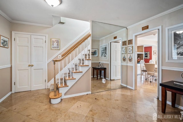 entryway featuring ornamental molding