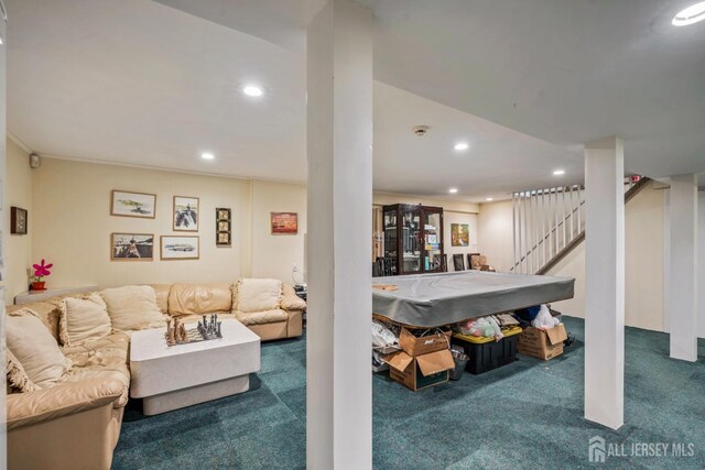 carpeted living room featuring crown molding and pool table