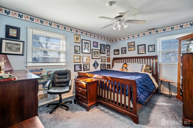 bedroom with ceiling fan and carpet floors