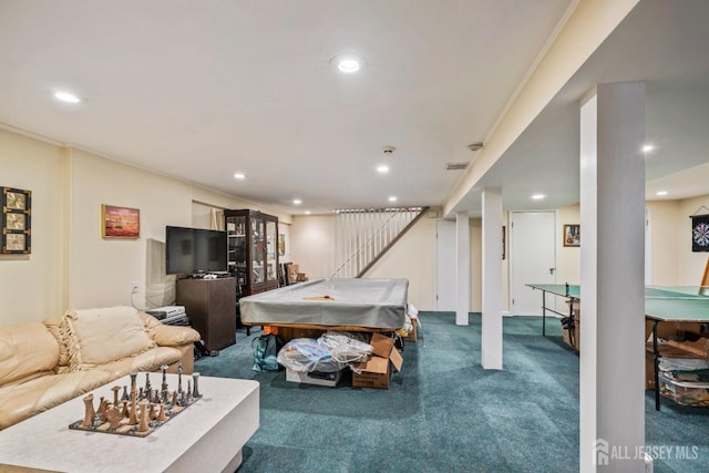 recreation room with crown molding and carpet flooring