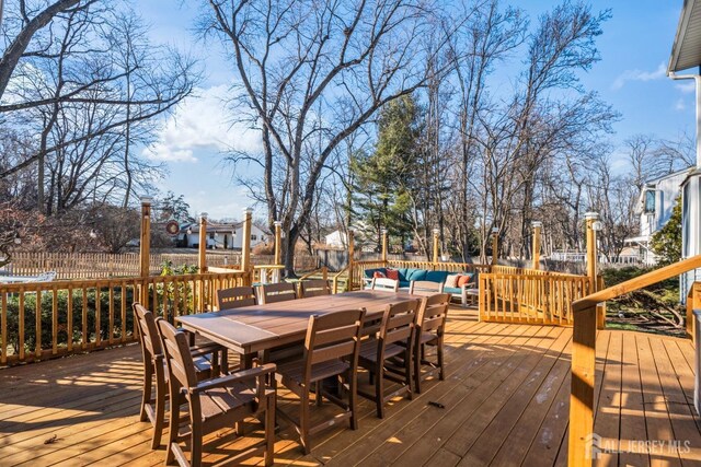 wooden terrace featuring an outdoor hangout area