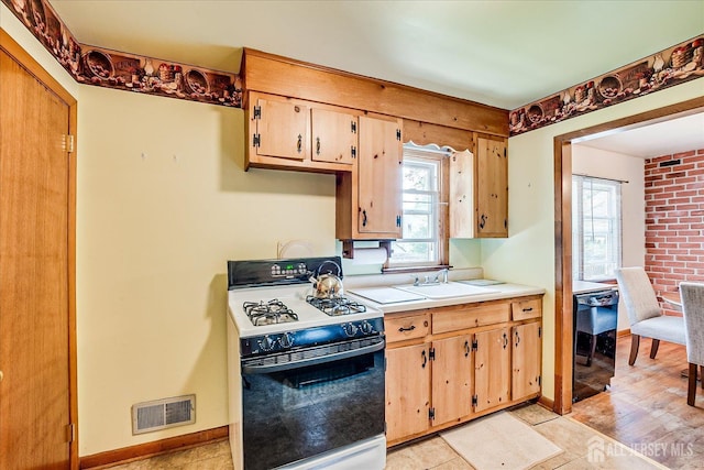 108 Smith St, South Plainfield, NJ 07080 - kitchen with white range with gas cooktop and light countertops