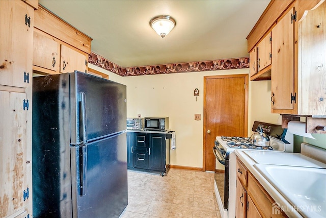108 Smith St, South Plainfield, NJ 07080 - kitchen featuring black appliances and light countertops