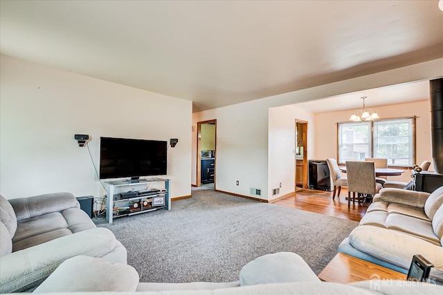 108 Smith St, South Plainfield, NJ 07080 - living area with a chandelier and carpet flooring