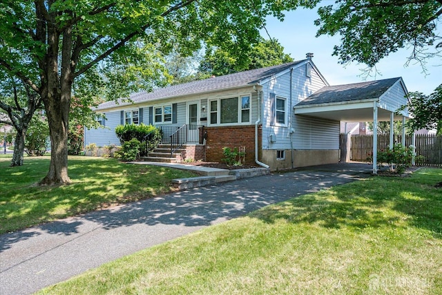 108 Smith St, South Plainfield, NJ 07080 - ranch-style home with asphalt driveway, an attached carport, and brick siding