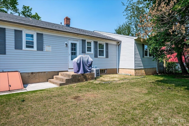 108 Smith St, South Plainfield, NJ 07080 - back of house with a yard and a chimney