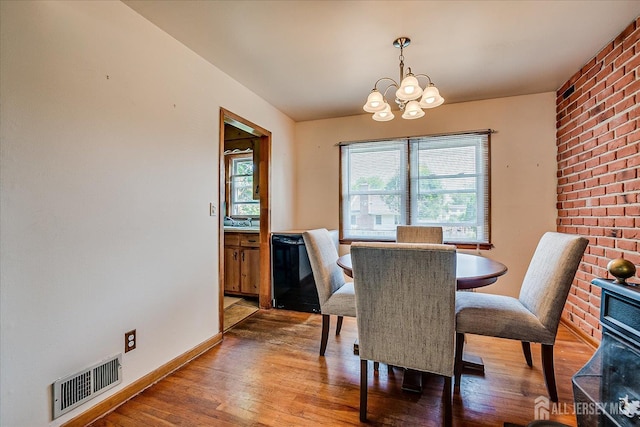 108 Smith St, South Plainfield, NJ 07080 - dining area with light wood-style flooring, a chandelier, and plenty of natural light