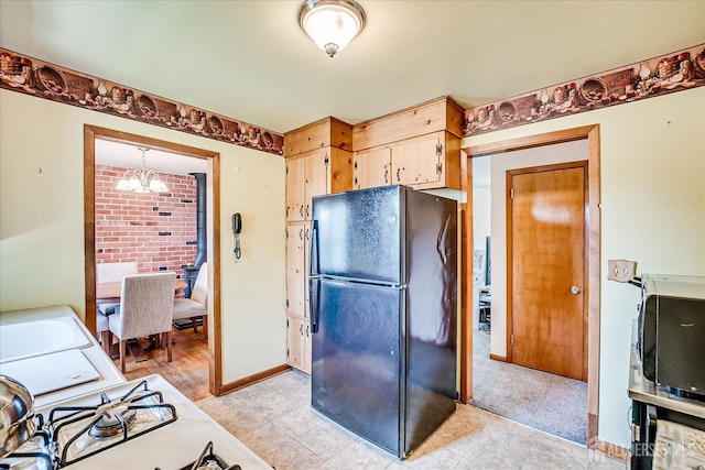 108 Smith St, South Plainfield, NJ 07080 - kitchen featuring freestanding refrigerator, a chandelier, and light countertops