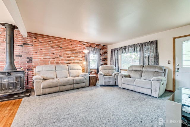 108 Smith St, South Plainfield, NJ 07080 - living area featuring a wood stove and brick wall