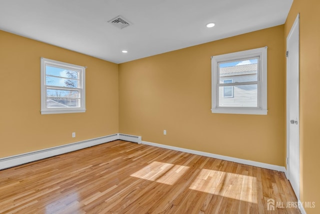 14 Ridgeview Rd, Jamesburg, NJ 08831 - spare room featuring light wood finished floors, baseboards, baseboard heating, and recessed lighting