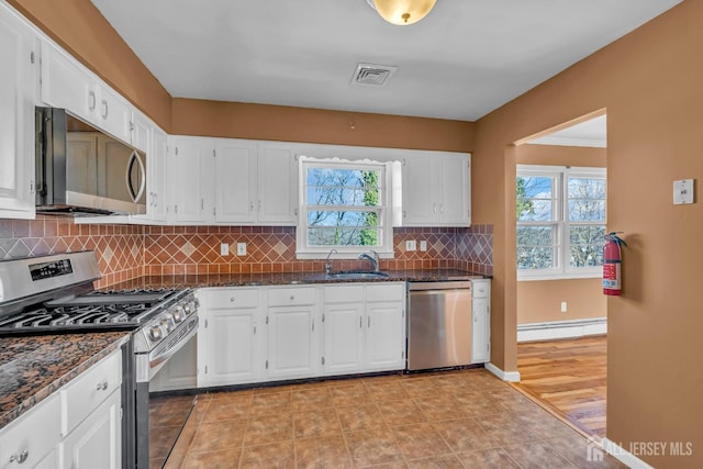 14 Ridgeview Rd, Jamesburg, NJ 08831 - kitchen with appliances with stainless steel finishes, a baseboard radiator, a sink, and plenty of natural light