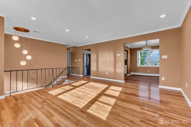 14 Ridgeview Rd, Jamesburg, NJ 08831 - empty room with ornamental molding, wood finished floors, a baseboard radiator, baseboards, and recessed lighting