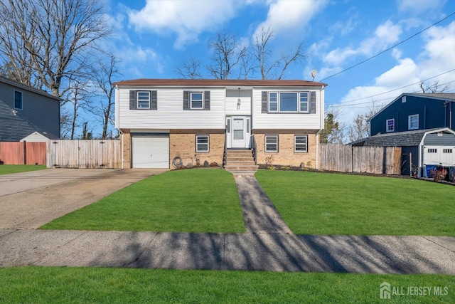 14 Ridgeview Rd, Jamesburg, NJ 08831 - raised ranch featuring concrete driveway, brick siding, an attached garage, and entry steps