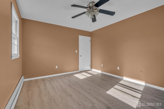14 Ridgeview Rd, Jamesburg, NJ 08831 - unfurnished room featuring a baseboard radiator, light wood-style flooring, baseboards, and ceiling fan
