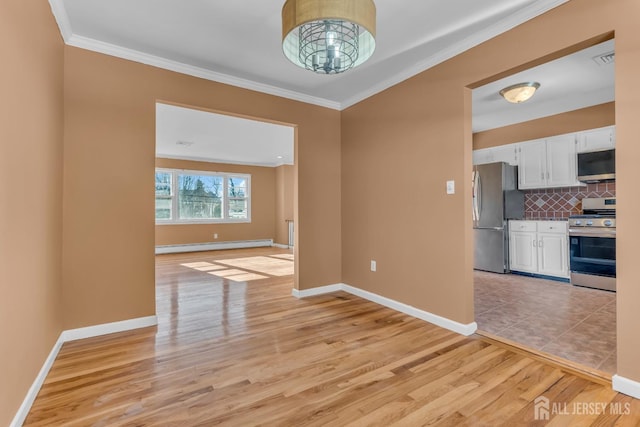 14 Ridgeview Rd, Jamesburg, NJ 08831 - unfurnished dining area featuring ornamental molding, baseboard heating, light wood-type flooring, and baseboards