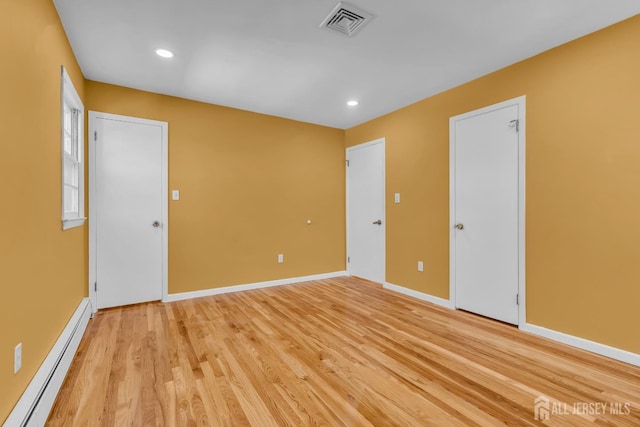 14 Ridgeview Rd, Jamesburg, NJ 08831 - spare room with baseboard heating, light wood-type flooring, baseboards, and recessed lighting