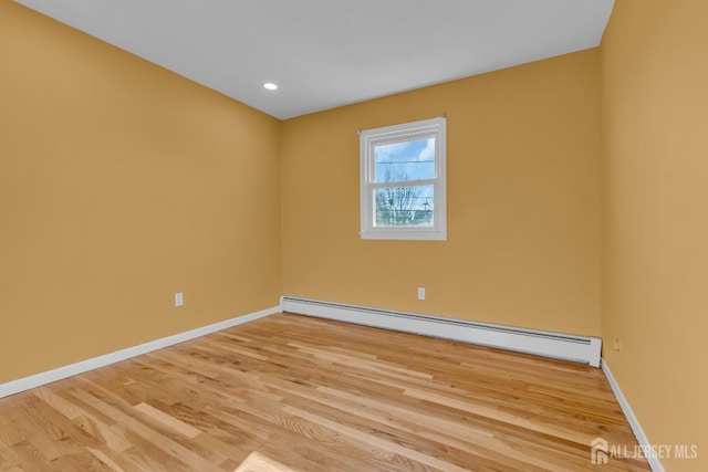 14 Ridgeview Rd, Jamesburg, NJ 08831 - empty room featuring baseboard heating, wood finished floors, baseboards, and recessed lighting