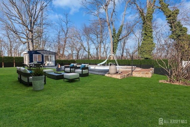 14 Ridgeview Rd, Jamesburg, NJ 08831 - view of yard featuring an outbuilding and outdoor lounge area