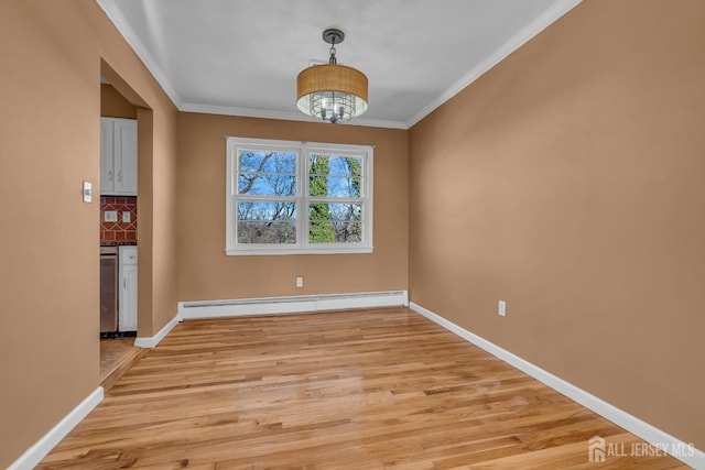 14 Ridgeview Rd, Jamesburg, NJ 08831 - unfurnished dining area featuring a baseboard radiator, light wood-type flooring, ornamental molding, and baseboards
