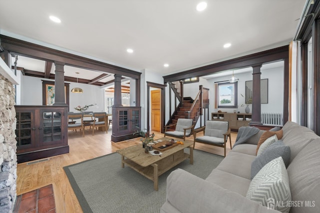 657 Amboy Ave, Edison, NJ 08837 - living room featuring decorative columns, stairway, wood finished floors, recessed lighting, and beam ceiling