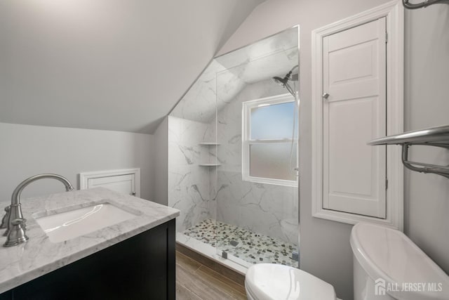 657 Amboy Ave, Edison, NJ 08837 - bathroom with toilet, vaulted ceiling, a marble finish shower, wood finished floors, and vanity