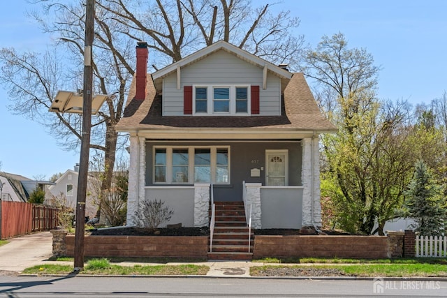 657 Amboy Ave, Edison, NJ 08837 - bungalow-style home featuring stairway, covered porch, and a chimney